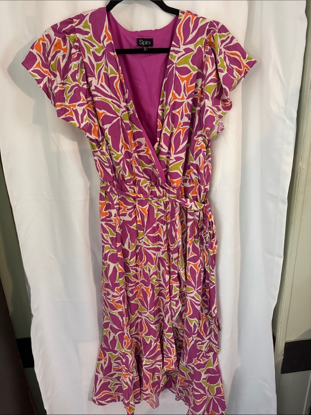 Spin 3XL Wrap Dress in Fuchsia Floral featuring an abstract botanical/leaf print